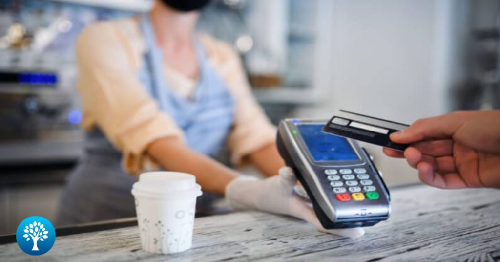 person-using-debt-card-to-purchase-coffees